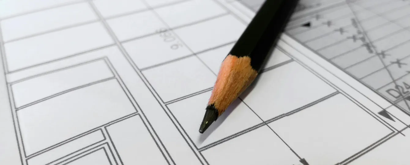 Project Management team supervising technical blueprints for timely marine interior delivery.