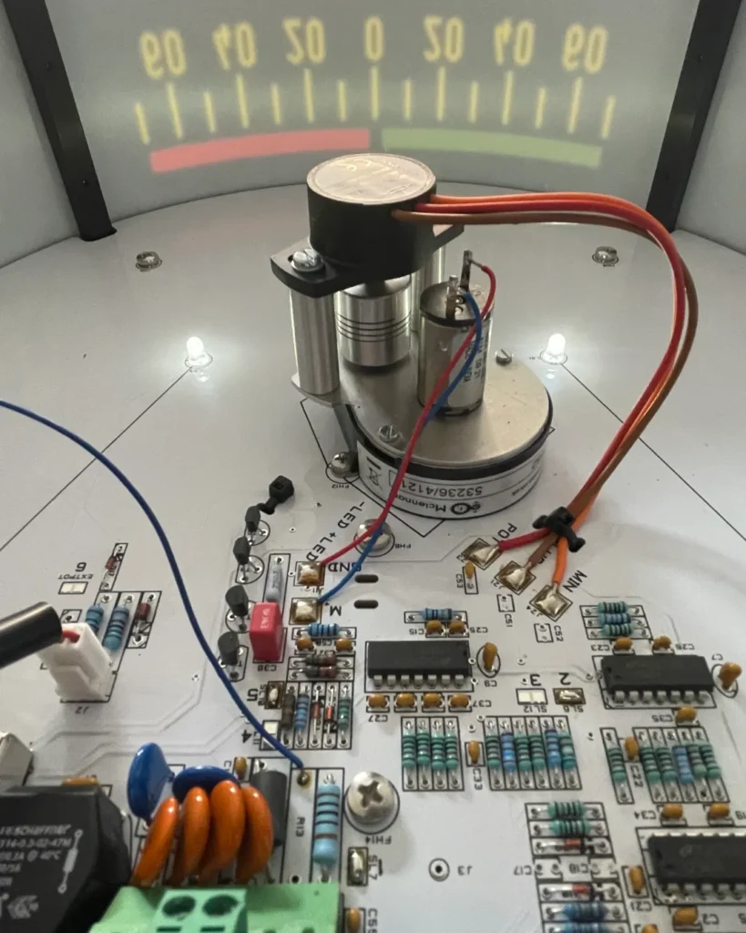 Professional technician repairing a marine electronic circuit board in a specialized electrical workshop.